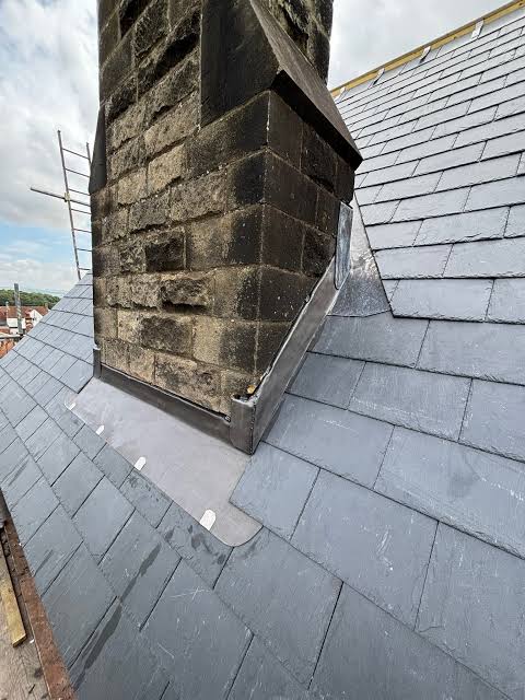 New lead flashing around a stone chimney
