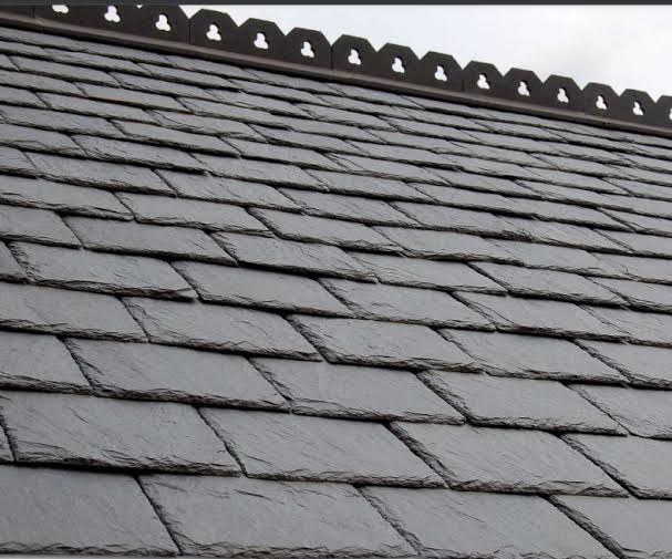 Slate roof with crested ridge tiles